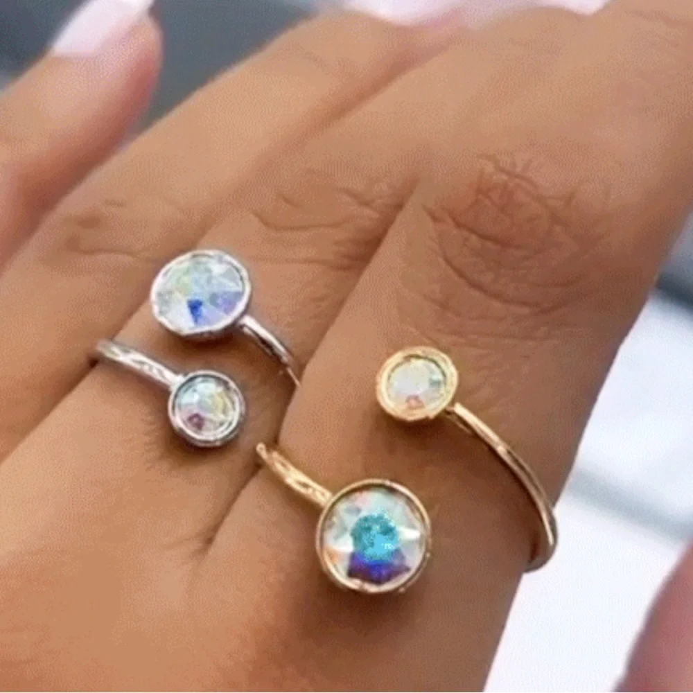 Curled up ring with two Swarovski crystals in Aurore Boreale fits size 6-7 BNIB